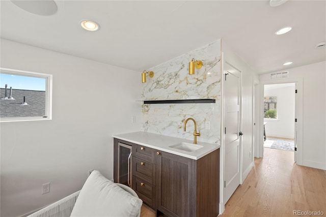 1645 N Osceola St, Denver, CO 80204 - indoor wet bar featuring healthy amount of natural light, wine cooler, light wood-style floors, and recessed lighting