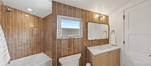 1645 N Osceola St, Denver, CO 80204 - full bath featuring vanity, shower / bath combination with curtain, and tile walls
