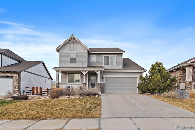 craftsman house featuring a porch, an attached garage, concrete driveway, stone siding, and board and batten siding