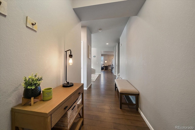 corridor featuring dark hardwood / wood-style flooring