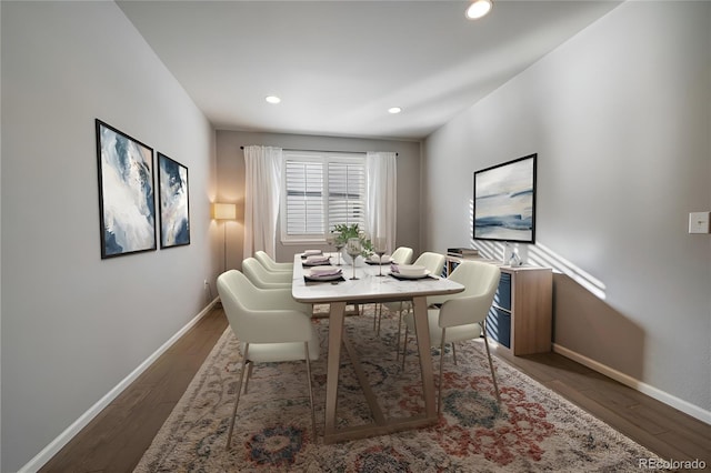 dining space featuring dark wood-type flooring