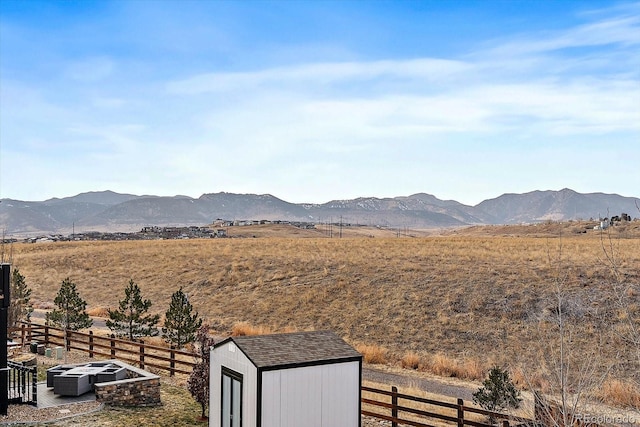 view of mountain feature with a rural view