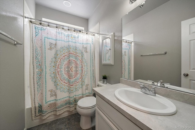 full bathroom featuring shower / bath combo, toilet, and vanity