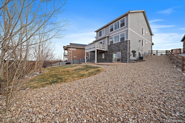 rear view of house with a patio and a deck