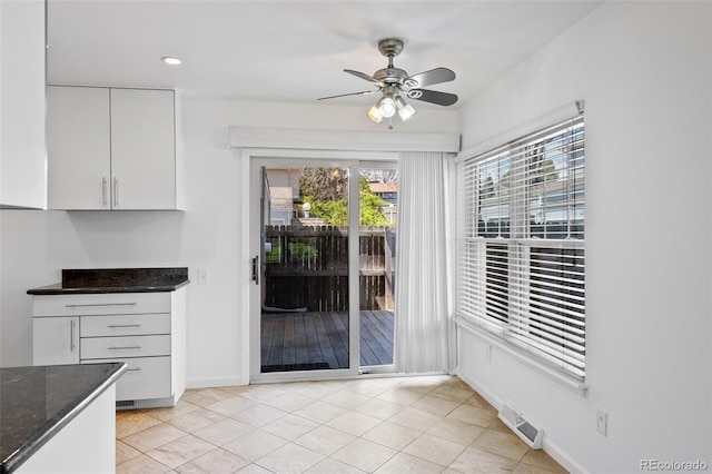 unfurnished dining area featuring a ceiling fan, baseboards, visible vents, and recessed lighting