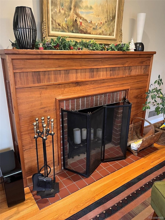 details featuring a fireplace and hardwood / wood-style floors