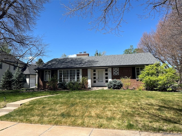 701 S Clayton St, Denver, CO 80209 - single story home featuring brick siding, a front yard, and a chimney