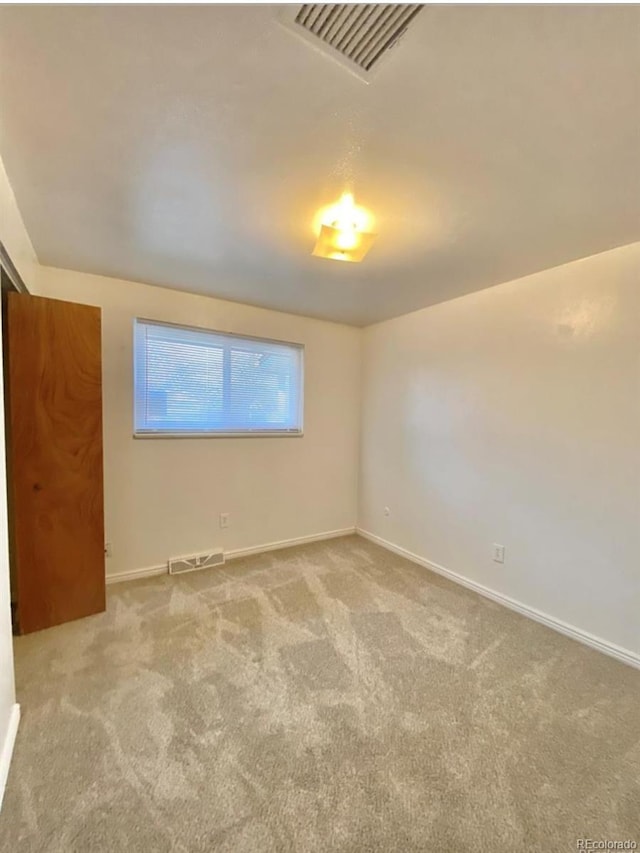 13024 E Alaska Pl, Aurora, CO 80012 - carpeted spare room featuring baseboards