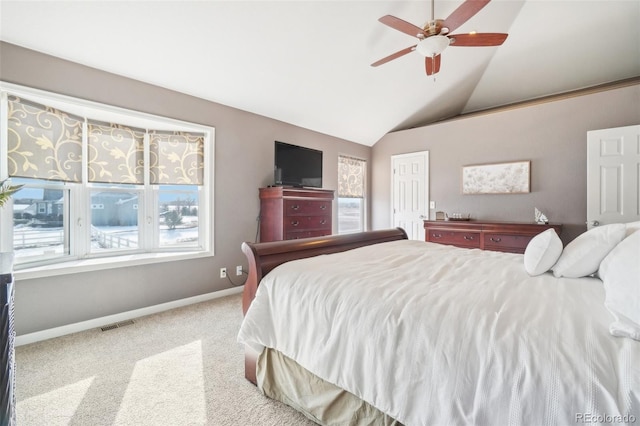 bedroom featuring vaulted ceiling, light colored carpet, and ceiling fan