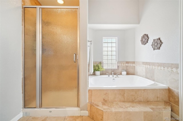 bathroom featuring tile patterned flooring and plus walk in shower