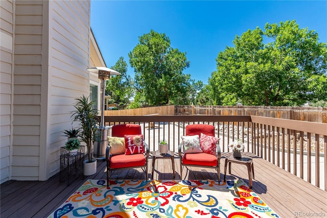 wooden deck featuring a fenced backyard