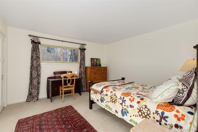 bedroom featuring light colored carpet