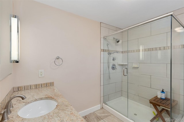 bathroom featuring walk in shower, tile patterned flooring, and vanity