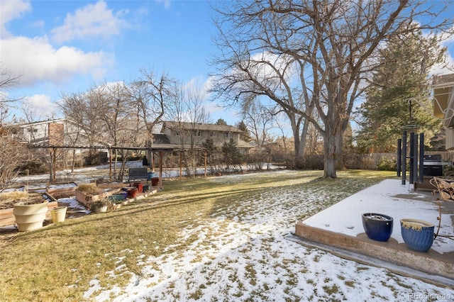 view of yard layered in snow