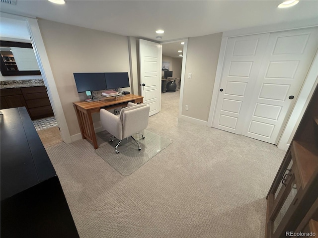 office with baseboards, visible vents, recessed lighting, and light colored carpet