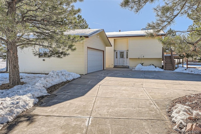 view of side of property with a garage