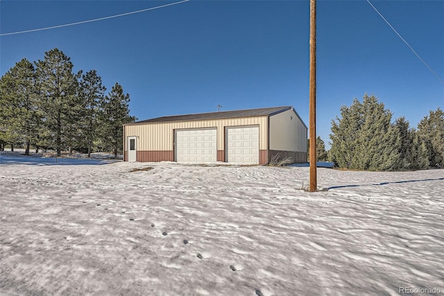 view of snow covered garage