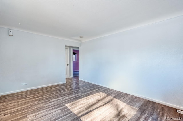 unfurnished room featuring wood-type flooring