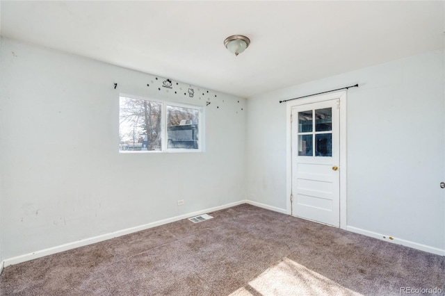 unfurnished room featuring carpet flooring