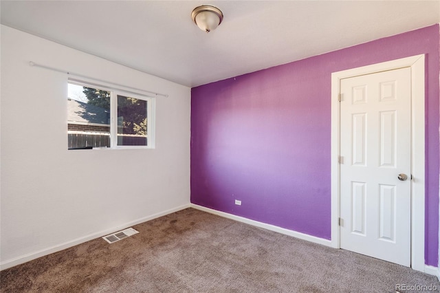 empty room featuring carpet