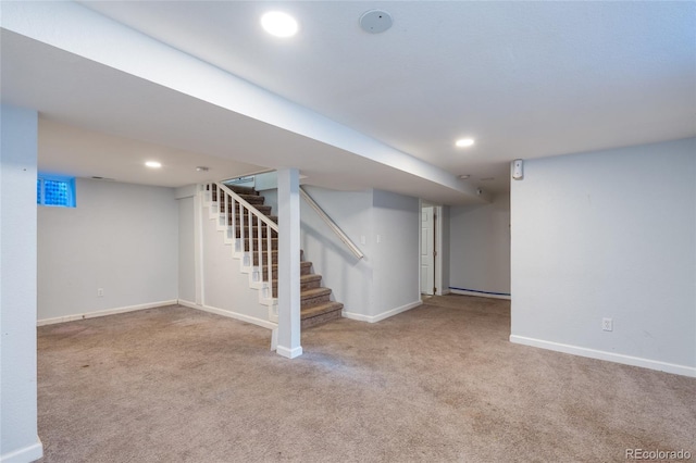 basement featuring light carpet