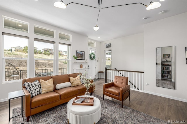 11027 Sunshimmer Cir, Parker, CO 80134 - living room featuring dark wood-style flooring and baseboards