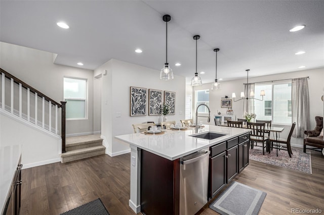 11027 Sunshimmer Cir, Parker, CO 80134 - kitchen with a sink, stainless steel dishwasher, light countertops, dark wood finished floors, and recessed lighting