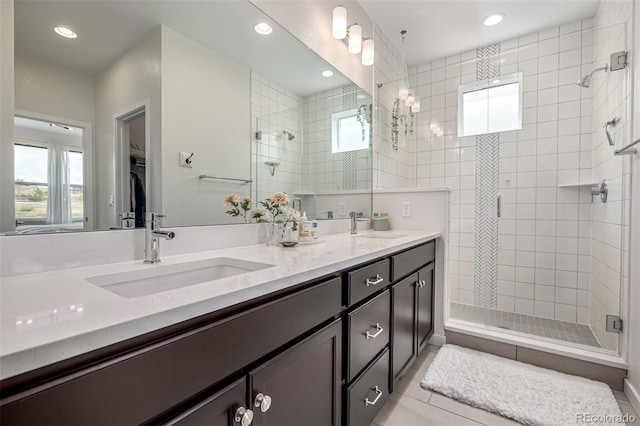 11027 Sunshimmer Cir, Parker, CO 80134 - bathroom with healthy amount of natural light, a shower stall, double vanity, recessed lighting, and tile patterned floors
