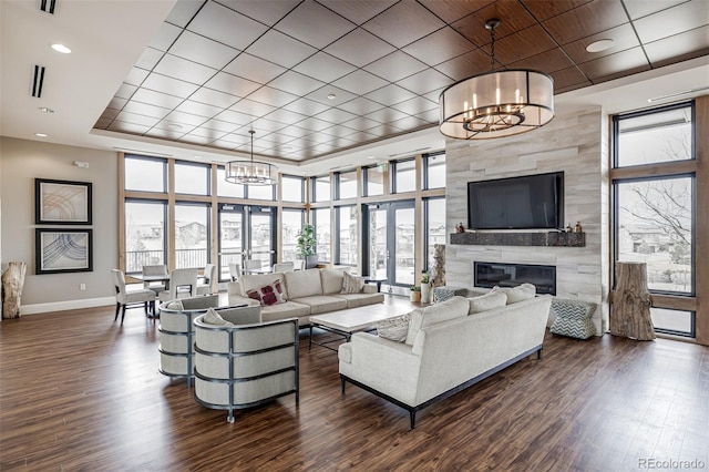 11027 Sunshimmer Cir, Parker, CO 80134 - living area featuring a chandelier, plenty of natural light, baseboards, and dark wood-style flooring