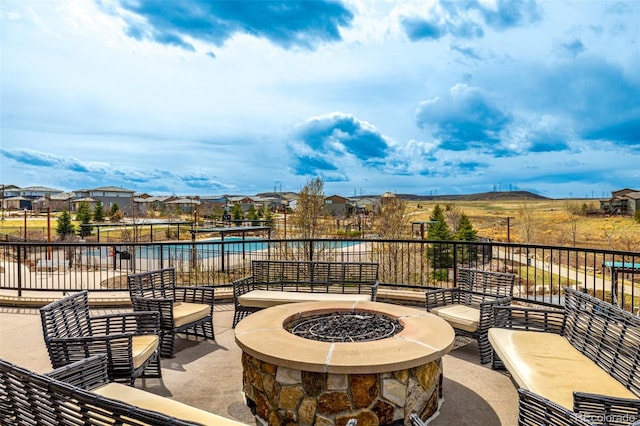11027 Sunshimmer Cir, Parker, CO 80134 - view of patio / terrace with an outdoor fire pit