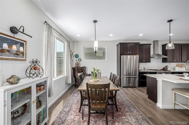 11027 Sunshimmer Cir, Parker, CO 80134 - dining room with dark wood-type flooring, beverage cooler, and recessed lighting