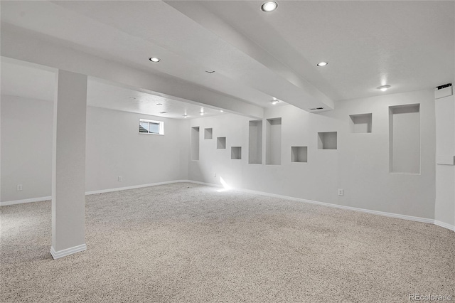 spare room featuring light carpet, recessed lighting, and baseboards