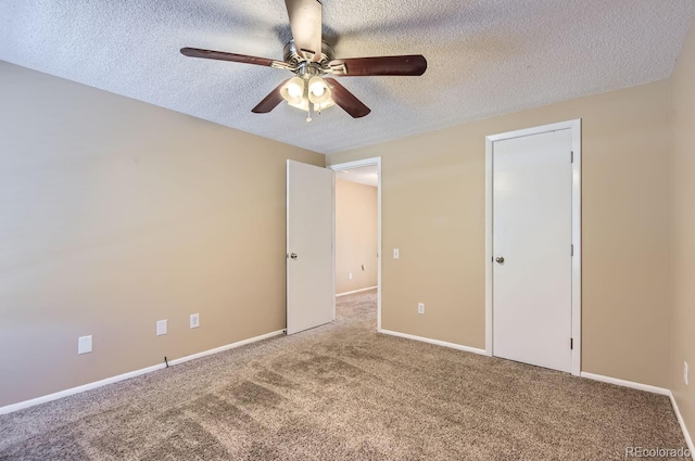 unfurnished bedroom featuring carpet flooring, ceiling fan, and a textured ceiling