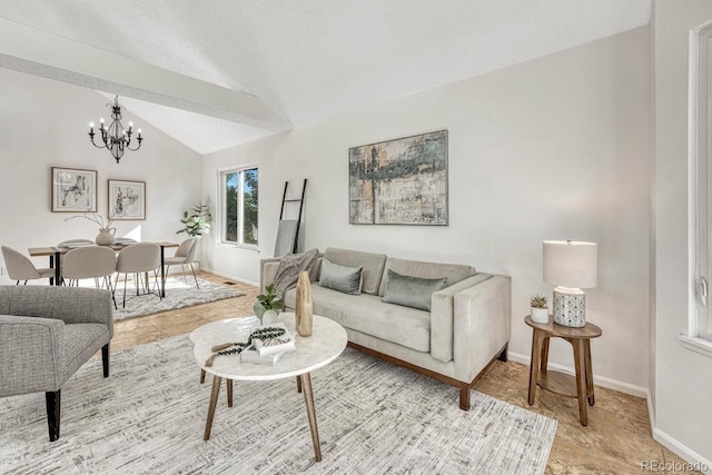 living room featuring a textured ceiling, baseboards, a notable chandelier, and vaulted ceiling