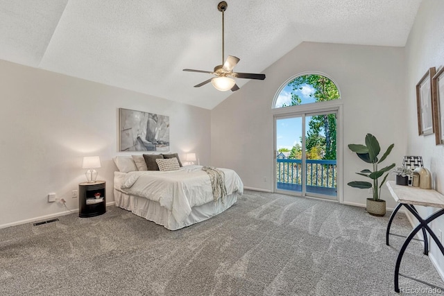 bedroom with access to exterior, carpet, visible vents, and a textured ceiling