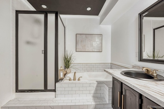 bathroom featuring a bath, recessed lighting, a stall shower, and vanity