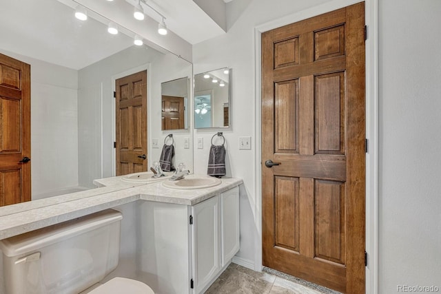 full bath with toilet and vanity