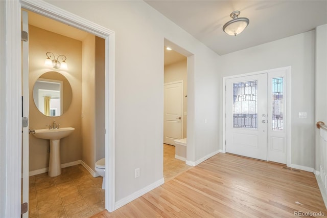 entrance foyer with light hardwood / wood-style floors