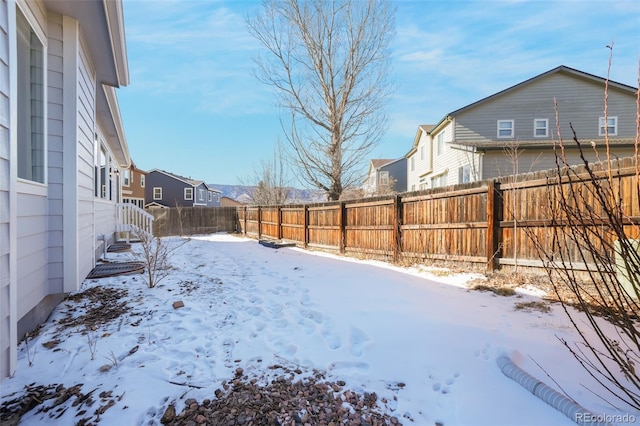 view of yard layered in snow