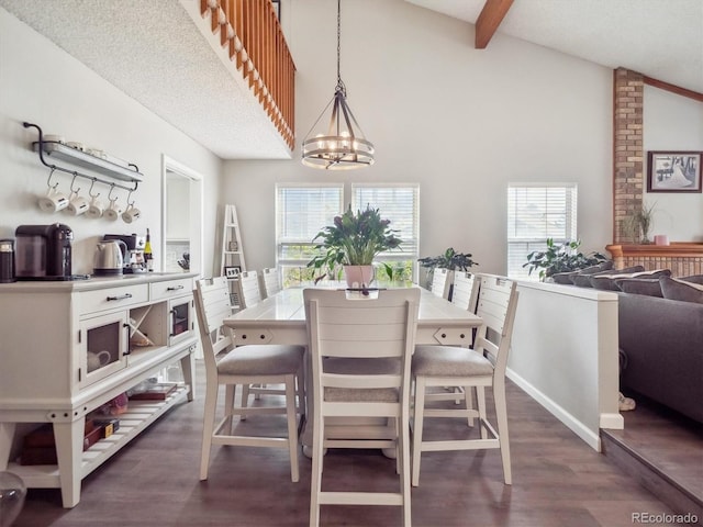 dining area featuring beamed ceiling, an inviting chandelier, dark wood-style floors, and high vaulted ceiling