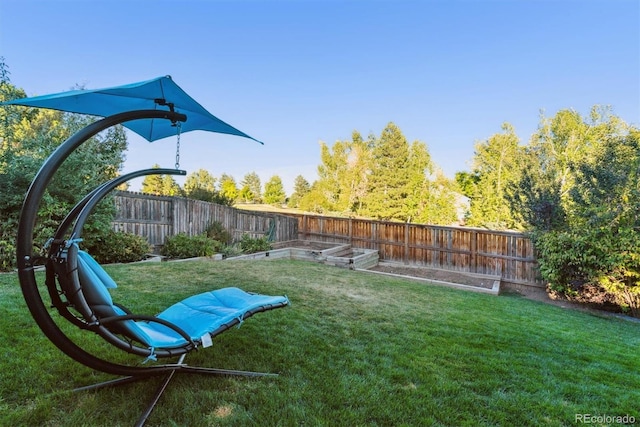 view of yard featuring a fenced backyard