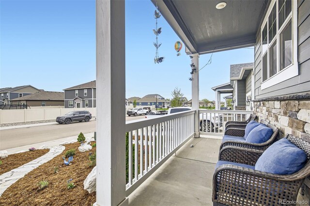 balcony with a porch and a residential view