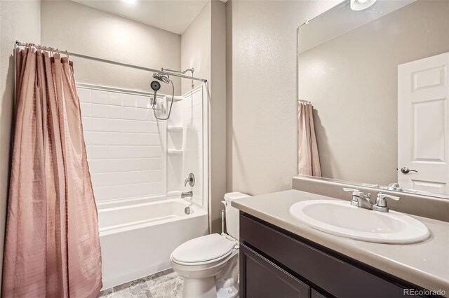 bathroom with toilet, vanity, shower / tub combo, and a textured wall