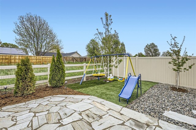 view of patio with a playground