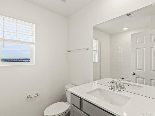 full bathroom featuring toilet and vanity