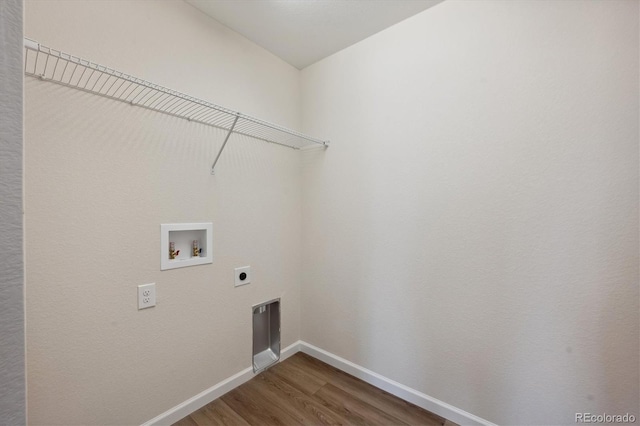 washroom featuring hookup for a washing machine, hardwood / wood-style floors, and hookup for an electric dryer