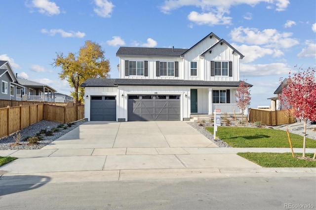 view of front of home featuring a front lawn and a garage