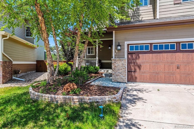 10358 Kelliwood Way, Highlands Ranch, CO 80126 - view of exterior entry featuring a porch, a garage, and concrete driveway