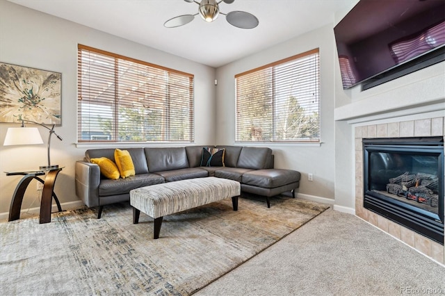 10358 Kelliwood Way, Highlands Ranch, CO 80126 - carpeted living room with a fireplace, ceiling fan, and baseboards