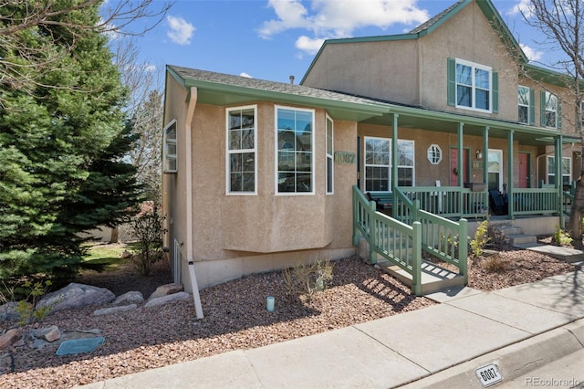 6087 Colony Cir, Colorado Springs, CO 80919 - view of front of home featuring covered porch and stucco siding